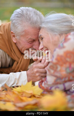 Senior couple in autumn park Stock Photo - Alamy