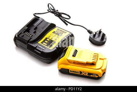 SWINDON, UK - AUGUST 5, 2018: DeWalt DCB113 cordless power tool battery charger and battery on a white background Stock Photo