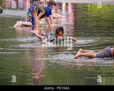 Children playing in  Crown Fountain, Millennium Park, Chicago, Illinois. Stock Photo