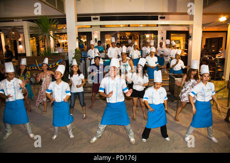 BORACAY, PHILIPHINES-MARCH 19, 2016:Group of chefs dancing in frot of a public restaurant on March 19, 2016. Boracay, Philippines. Stock Photo