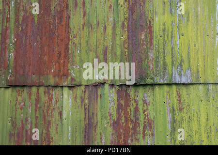 Rusting Corrugated sheets on a farm building as a background Stock Photo