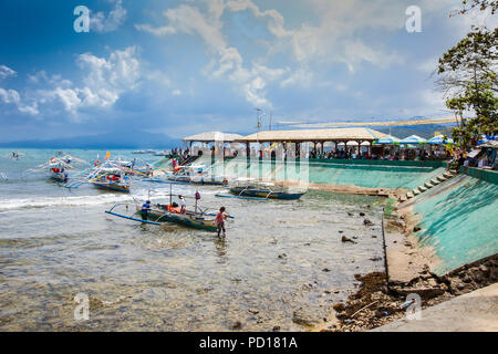 SABANG, PHILIPPINES-MARCH 27, 2016, Longtail boats line from Sabang to cave entrance of Puerto Princesa subterranean underground river, one of the 7 N Stock Photo