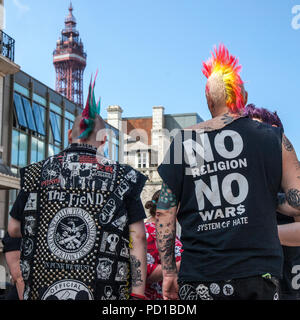 Blackpool, UK. 5 August 2018.  Colourful characters at the resort Rebellion Punk Festival. Rebellion Festival, formerly Holidays in the Sun and the Wasted Festival is a British punk rock festival first held in 1996. Blackpool's annual display of coloured hair, clothing and ripped leg-wear is back as every August in Blackpool, the very best in Punk gather for the social event of the year.  Credit: MediaWorldImages/AlamyLiveNews Stock Photo