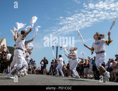 Sidmouth, 5th Aug 18 Dancing in the street at Sidmouth Folk Week where traditional dances from around Europe are performed on the seafront Esplanade. PhotoCentral / Alamy Live News Stock Photo