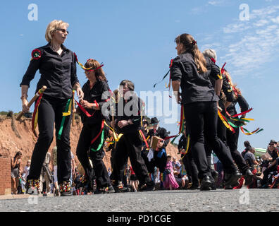 Sidmouth, 5th Aug 18 Dancing in the street at Sidmouth Folk Week where traditional dances from around Europe are performed on the seafront Esplanade. PhotoCentral / Alamy Live News Stock Photo