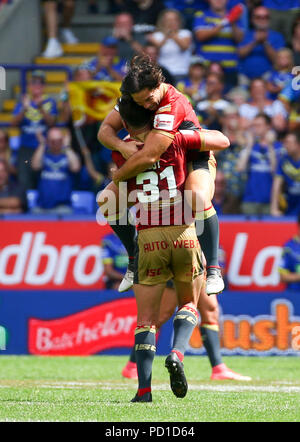 Bolton, UK. 5 August 2018. The University of Bolton Stadium, Bolton, England; Ladbrokes Challenge Cup Rugby semi final, St Helens versus Catalans Dragons; Tony Gigot celebrates with Jason Baitieri of Catalan Dragons at the end of the 16-35 victory Stock Photo