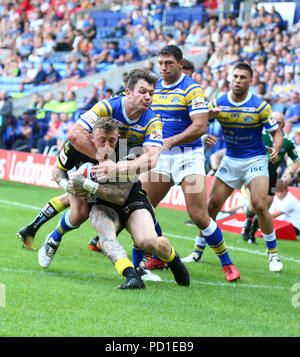 Bolton, UK. 5 August 2018. Ladbrokes Challenge Cup Rugby semi final, Warrington Wolves versus Leeds Rhinos; Josh Charnley of Warrington Wolves is tackled by Brett Ferres of Leeds Rhinos Credit: Action Plus Sports Images/Alamy Live News Stock Photo