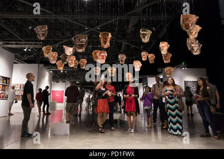 Seattle, Washington: "Probably Chelsea" on display during the Seattle Art Fair at CenturyLink Field Event Center. The work, by artist Heather Dewey-Hagborg, consists of thirty different possible portraits of Chelsea Manning algorithmically-generated by an analysis of her DNA. Chelsea Manning provided DNA samples that were extracted and analyzed to create 3d printed life size models of her portrait. Founded in 2015 by Paul G. Allen, the annual exhibition includes galleries from all over the globe as well as Seattle’s Foster/White, Linda Hodges and many others. Stock Photo