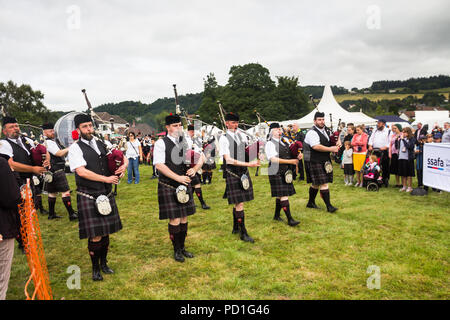 Stirling, Scotland, UK. 5th August 2018. Strathallan Games Park near Stirling is the venue for the 167th Bridge of Allan Highland Games.  Members of the Glenrothes and District Pipe Band march towards the main show ring to take part in the pipe band competition. Credit Joseph Clemson, JY News Images/Alamy Live News.
