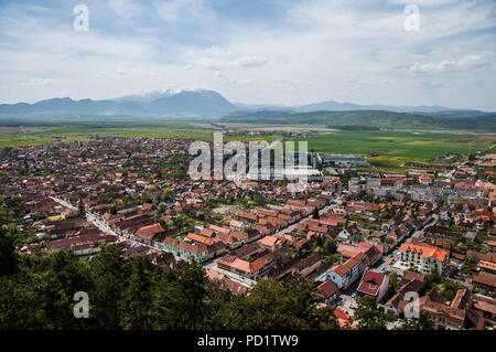 Stunning view from Fortress Rasnov to the main city and to the Piatra Craiului Mountains Stock Photo