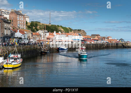 Fishing boats in Whitby harbour, North Yorkshire Stock Photo