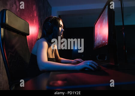 A Cute Female Gamer Girl Sits In A Cozy Room Behind A Computer And Plays Games Woman Live Streaming Computer Video Games To Her Fans Streamer And Gamer Concept Stock Photo