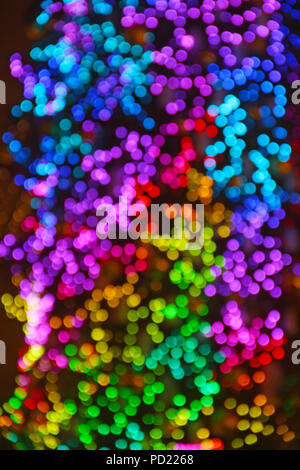 Multicolored abstract bokeh background with new year tree lights Stock Photo