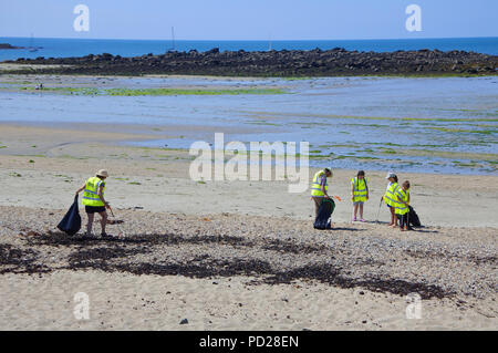 Volunteers cleaning the beach at Marazion, Cornwall, UK - John Gollop Stock Photo