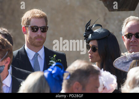 Meghan Markle ,the Duchess of Sussex,and Prince Harry at the wedding of Charlie Van Straubenzee and Daisy Jenks at  the Church of St. Mary the Virgin, Frensham,Surrey,on Saturday afternoon.  Prince Harry,the Duke of Sussex, was the best man and was accompanied by his wife Meghan,the Duchess of Sussex. Stock Photo