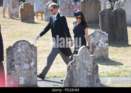 Picture dated August 4th 2018 shows Meghan Markle ,the Duchess of Sussex,and Prince Harry leaving  the wedding of Charlie Van Straubenzee and Daisy Jenks at  the Church of St. Mary the Virgin, Frensham,Surrey,on Saturday afternoon.  Prince Harry,the Duke of Sussex, was the best man and was accompanied by his wife Meghan,the Duchess of Sussex. Stock Photo