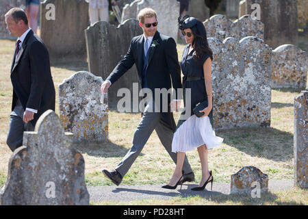 Picture dated August 4th 2018 shows Meghan Markle ,the Duchess of Sussex,and Prince Harry leaving  the wedding of Charlie Van Straubenzee and Daisy Jenks at  the Church of St. Mary the Virgin, Frensham,Surrey,on Saturday afternoon.  Prince Harry,the Duke of Sussex, was the best man and was accompanied by his wife Meghan,the Duchess of Sussex. Stock Photo