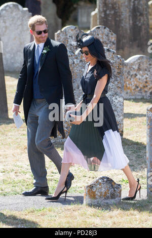 Picture dated August 4th 2018 shows Meghan Markle ,the Duchess of Sussex,and Prince Harry leaving  the wedding of Charlie Van Straubenzee and Daisy Jenks at  the Church of St. Mary the Virgin, Frensham,Surrey,on Saturday afternoon.  Prince Harry,the Duke of Sussex, was the best man and was accompanied by his wife Meghan,the Duchess of Sussex. Stock Photo