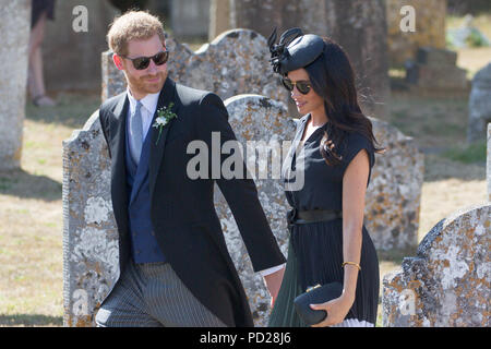 Picture dated August 4th 2018 shows Meghan Markle ,the Duchess of Sussex,and Prince Harry leaving  the wedding of Charlie Van Straubenzee and Daisy Jenks at  the Church of St. Mary the Virgin, Frensham,Surrey,on Saturday afternoon.  Prince Harry,the Duke of Sussex, was the best man and was accompanied by his wife Meghan,the Duchess of Sussex. Stock Photo