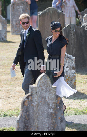 Picture dated August 4th 2018 shows Meghan Markle ,the Duchess of Sussex,and Prince Harry leaving  the wedding of Charlie Van Straubenzee and Daisy Jenks at  the Church of St. Mary the Virgin, Frensham,Surrey,on Saturday afternoon.  Prince Harry,the Duke of Sussex, was the best man and was accompanied by his wife Meghan,the Duchess of Sussex. Stock Photo