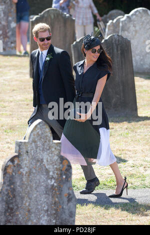 Picture dated August 4th 2018 shows Meghan Markle ,the Duchess of Sussex,and Prince Harry leaving  the wedding of Charlie Van Straubenzee and Daisy Jenks at  the Church of St. Mary the Virgin, Frensham,Surrey,on Saturday afternoon.  Prince Harry,the Duke of Sussex, was the best man and was accompanied by his wife Meghan,the Duchess of Sussex. Stock Photo