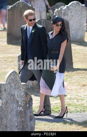 Picture dated August 4th 2018 shows Meghan Markle ,the Duchess of Sussex,and Prince Harry leaving  the wedding of Charlie Van Straubenzee and Daisy Jenks at  the Church of St. Mary the Virgin, Frensham,Surrey,on Saturday afternoon.  Prince Harry,the Duke of Sussex, was the best man and was accompanied by his wife Meghan,the Duchess of Sussex. Stock Photo