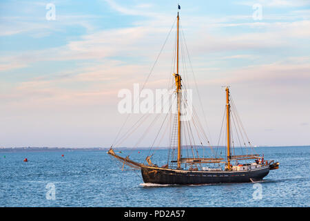 Baltic Trader Queen Galadriel ship  in Studland Bay heading to Poole Harbour on a lovely summer evening in August Stock Photo