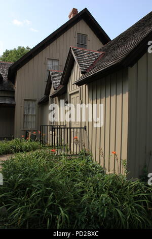 An old historic farmhouse with vertical siding. Stock Photo