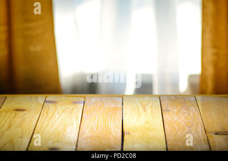 Empty Wooden Table in Front of Blurred Background of Window Curtains in Living Room. Mock Up for Display of Product. Blank for Your Layout Stock Photo