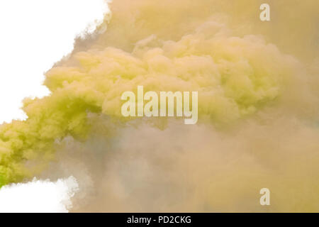 Yellow smoke, isolated on white background. Stock Photo
