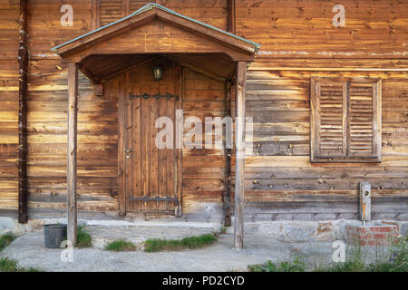 Wooden Locked Door and wooden bungalow house entrance Stock Photo