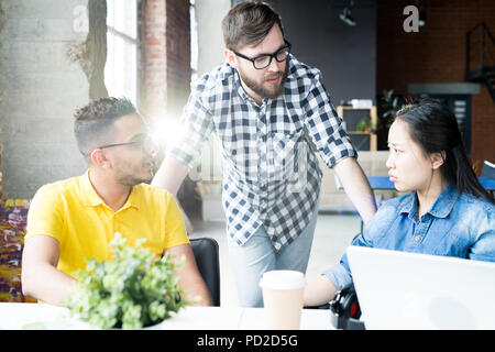 Creative Business Team Discussing Plan  in Office Stock Photo