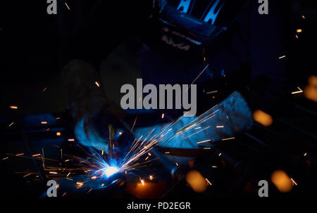 Welder at work with sparks flying Stock Photo