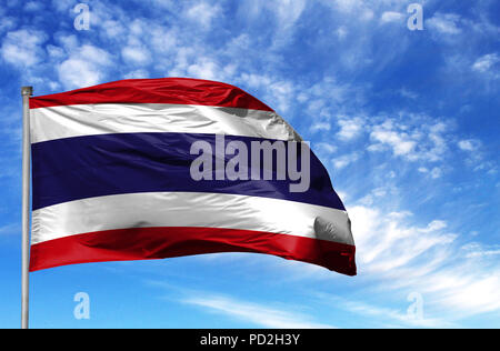 National flag of Costa Rica on a flagpole in front of blue sky. Stock Photo