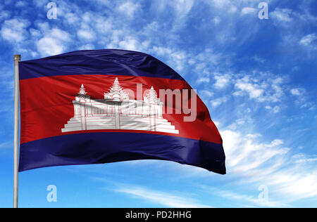 National flag of Cambodia on a flagpole in front of blue sky. Stock Photo