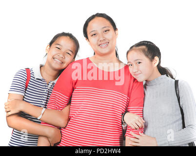 relationship of three cheerful asian teenager toothy smiling face happiness emotion on white background Stock Photo