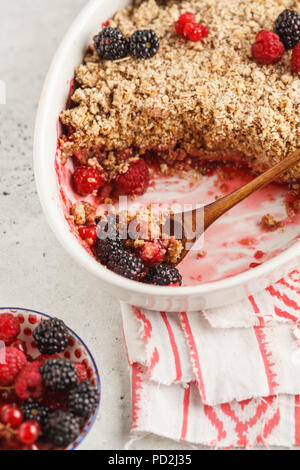 Breakfast with coffee and crumble pie, white background, healthy breakfast concept. Vegan berry dessert. Stock Photo