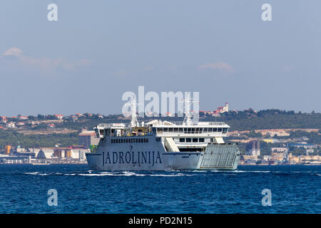 Zadar, Croatia - July 24, 2018: Ferry boat navigating from island Ugljan to the town of Zadar Stock Photo