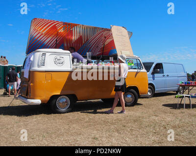 A classic VW campervan converted into a mobile coffee shop and juice bar Stock Photo
