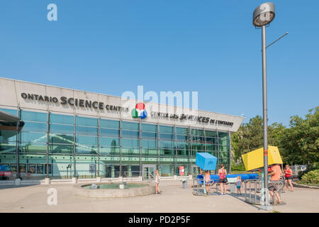 Families participate with the interactive displays outside of the Ontario Science Centre in Toronto Ontario Canada. Stock Photo