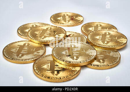 Golden Bitcoins on white background.Virtual money. Stock Photo