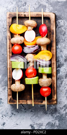 Grilled vegetable kebabs on skewers with tomato, pepper, mushrooms,zucchini and onion.Vegan diet.Vegetables kebab Stock Photo