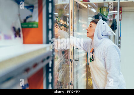 Woman wearing adult bodysuit shopping in supermarket Stock Photo