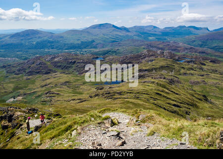 View from Cnicht mountain to distant Moel Hebog and Nantlle Ridge mountains on skyline in Snowdonia National Park. Croesor Gwynedd Wales UK Britain Stock Photo