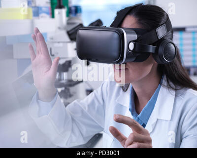 Sensual woman using augmented, virtual reality goggles feeling excited  about simulation, exploring virtual sexuality wearing sexy black bra and  gettin Stock Photo - Alamy