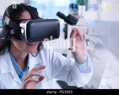 Scientist using virtual reality to understand a research experiment in the laboratory Stock Photo