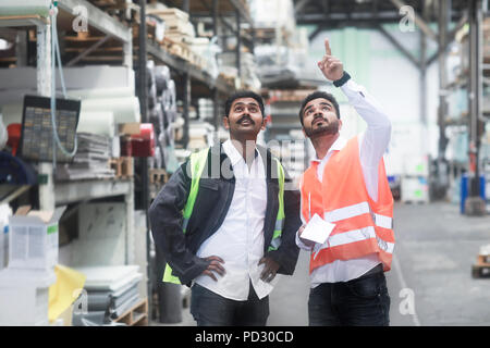 Engineers working in warehouse Stock Photo