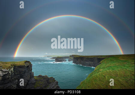 Rainbow over Kilkee Cliffs, Kilkee, Clare, Ireland Stock Photo