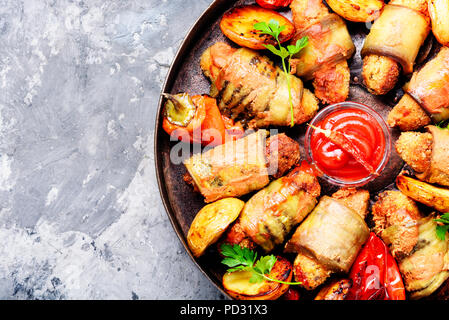 Turkish cuisine, meat fingers in eggplant rolls Stock Photo