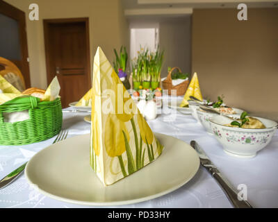 Traditional Polish Easter breakfast table with seasonal food and decorations Stock Photo